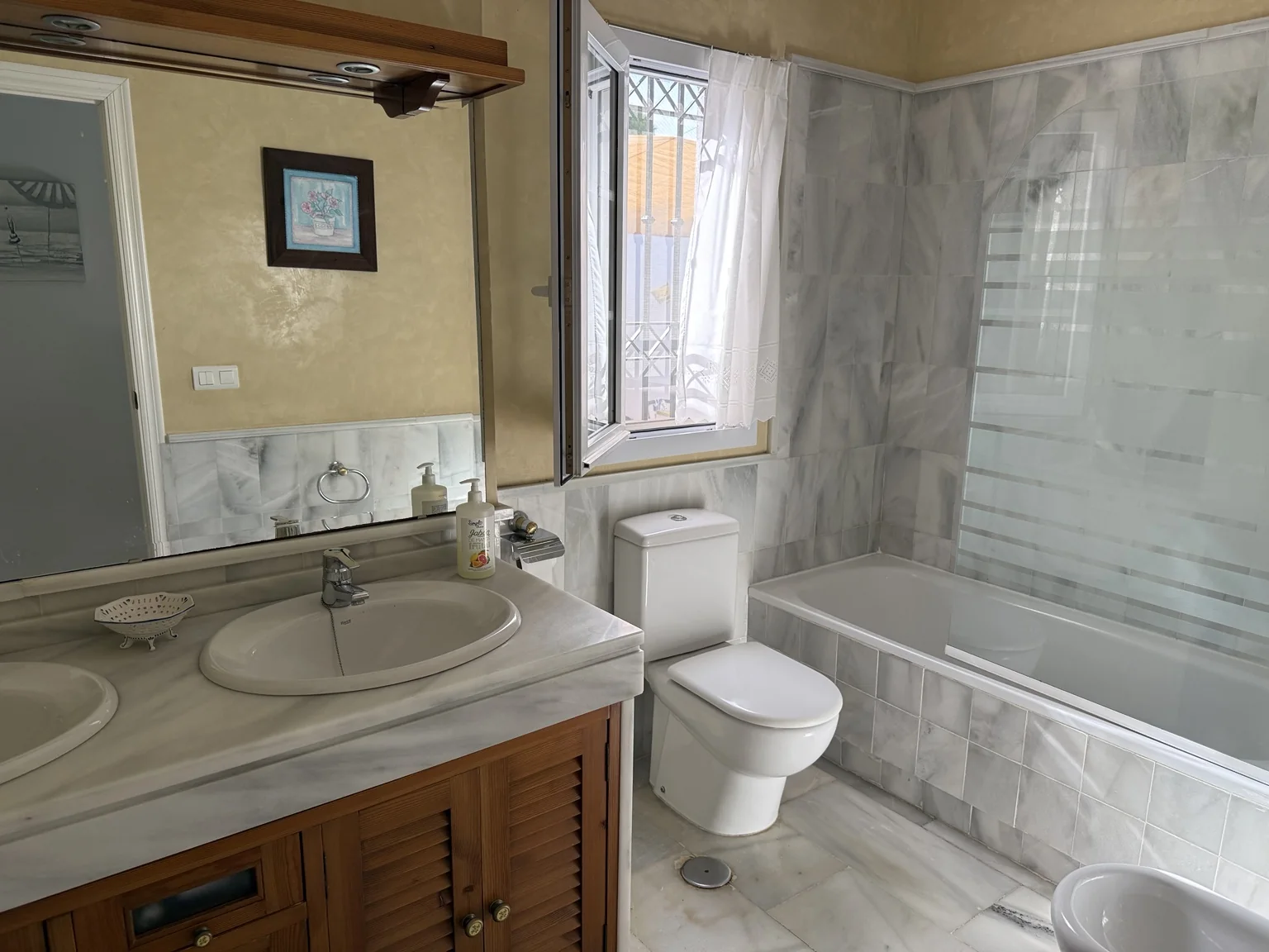 Main-suite bathroom with bath